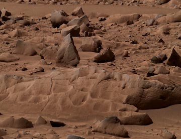 Before grinding with the abrasion tool, this approximate true-color image taken by the panoramic camera on the Mars Exploration Rover Spirit shows the rock dubbed "Mazatzal" before the rover drilled into it with its rock abrasion tool. Image credit: NASA/JPL/Cornell.
