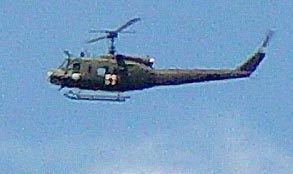 Military helicopter circling over the Mayville, Wisconsin, wheat formation in July 2003. Photograph © 2003 by Jeffrey Wilson and Roger Sugden, ICCRA.