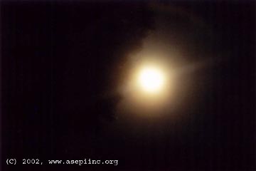 Unidentified light that set off computer alarm on August 20, 2002, at approximately 9:08 p.m. EDT. The bright object was moving northeast away from the camera. Photograph © 2002 by ASEPI member,  Jean L. from Saint-Jean-de-Matha, Quebec, Canada.