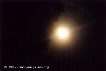 Unidentified light that set off computer alarm on August 20, 2002, at approximately 9:08 p.m. EDT. The bright object was moving northeast away from the camera. Photograph © 2002 by ASEPI member, Jean L. from Saint-Jean-de-Matha, Quebec, Canada.