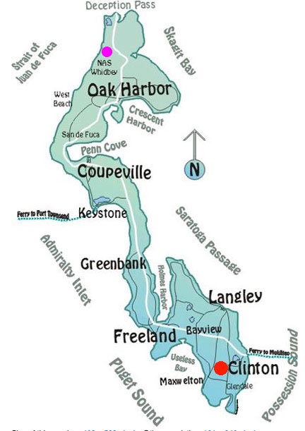 Clinton, population 928, is located on the southern tip of Whidbey Island in Island County, Washington (red circle). Much of the village and surrounding farms are situated on a high bluff overlooking Saratoga Passage on Puget Sound. The Naval Air Station is at the northern end of Whidbey Island (pink circle).