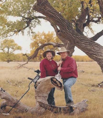 Sheri and Chuck Bowen with a metal detector and shovel on their Sand Creek ranch near Eads, Colorado. Photograph provided by the Bowens.