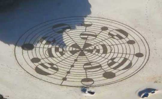 Mysterious sand spiral with intricate overlay of binary code circles at Watergate Bay Beach in Newquay, Cornwall County, U. K., on December 8, 2013. Image by Karen, posted on Facebook.