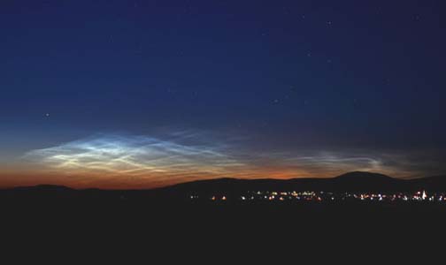 This AIM satellite image taken on June 15, 2007, in Budapest, Hungary, shows one of the first ground sightings of noctilucent clouds in the 2007 season. Image © 2007 by Veres Viktor.