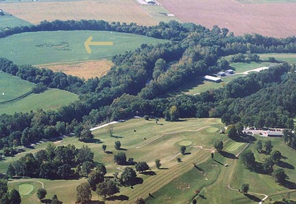 Golf course is laid out on ridge north of Paint Creek soybean formation marked by arrow. The ancient Seip Mound is two miles west beyond the golf course. Aerial photograph © 2003 by Dan Music and Jeffrey Wilson.