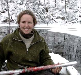 University of Alaska at Fairbanks researcher Katey Walter, Ph.D., conducting methane measurements on one of the study lakes September 2005 in Siberia. A new more accurate measuring technique was used on the bubbling methane, which is 23 times more powerful a greenhouse gas than the more prevalent carbon dioxide. "The effects can be huge," said Walter, the lead author of a study in the Thursday, Sept. 7, 2006, issue of the journal Nature. "It's coming out a lot and there's a lot more to come out."  Photo © 2005 by AP/Dmitri Draluk.