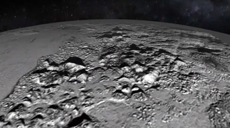 NASA's New Horizons spacecraft flying about 7,700 miles above the Norgay Montes ice mountains of Pluto where some peaks are two miles high! Video released by NASA on Friday, July 17, 2015. See: NASA flyover video.