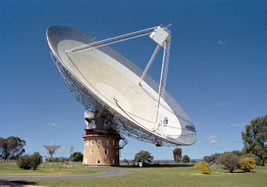 Parkes Radio Telescope, Australia, where “A Population of Fast Radio Bursts at Cosmological Distances,” was studied by astronomer Dan Thornton and international colleagues and published in Science on July 5, 2013. The radio signals have come from between 6 to 11 billion light-years away in this particular matter universe aged 13.8 billion light-years. Image by CSIRO.