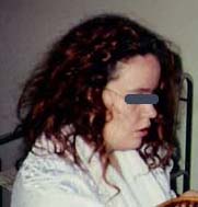 Left: "Rachel" in white robe as she was in February 1992, hair colored red. Eyes covered in Photoshop for identity protection. Right: Drawing by "Martin" of the tall, indigo blue-colored reptilian who "replaced" Rachel for several seconds. Phenomenon occurred in their shared apartment in southeastern U. S. Photo and drawing © 2006 by Earthfiles.