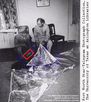 Brig. General Roger Ramey at Roswell Army Air Force Base, Roswell, New Mexico, July 1947. Red rectangle highlights the communique to Washington, D. C., Gen. Ramey is holding. The silver material on the floor is from a literal weather balloon, which was used as a false explanation for the alleged UFO crash debris rancher W. W. "Mac" Brazel found on his Corona, New Mexico, ranch on or about July 4, 1947. Photograph © 1947 by Fort Worth Star-Telegram.
