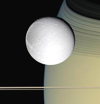 October 11, 2005, image of Saturn's icy moon, Dione, above the planet's thin rings. Behind Dione are the shadows of Saturn's B and C rings. Image from the Cassini spacecraft at 24,200 miles (39,000 kilometers) distance. Image courtesy NASA/JPL/Space Science Institute. 