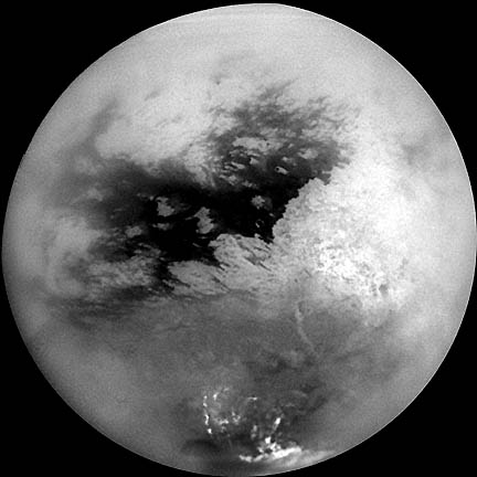 Scientists are trying to understand what they call "bizarre surface brightness patterns" seen in this October 26, 2004, composite image of Saturn's mysterious moon, Titan. Note the peculiar "noodle" features in the upper right corner of the unidentified dark area. Image Credit: NASA/JPL/Space Science Institute. 