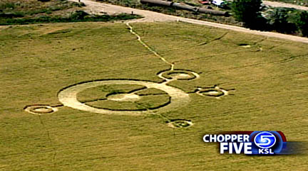 Twenty-three feet to the east of the large central ring (small circle with standing crop nearest Chopper 5 logo), an "eyeball" addition was discovered on Sunday, July 4, 2004, after a local Spanish Fork, Utah, family reported seeing small white lights moving in that same area after 11 p.m. MST on Saturday, July 3, 2004. Aerial photograph © 2004 by Channel 5 KSL-TV, Salt Lake City, used with permission.