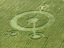 Spanish Fork, Utah, formation in barley first noticed by farm owners on Saturday night, June 26, 2004. Large ring measured 25 feet east to west and 24.5 feet north to south, almost a perfect circle. Whole formation, including later added fourth "eyeball" measured 207 feet by 118 feet. Aerial photograph © 2004 by KSL-TV, Channel 5, Salt Lake City, Utah.