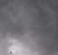 Summer 2007, pearl-like aerial objects over canyon Rim near Pine, Arizona, 17 miles north of Payson. Image ©2007 by L. Murray.