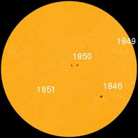 September 26, 2013, image of a few small, weak spots  not flaring, while solar activity remains low with little chance of flares. The sun's global x-ray emission remains nearly flat as well. Image SDO/HMI.