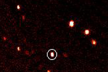 Tenth planet, 2003UB313, photographed above in the white circle by Palomar Observatory astronomers lead by Michael Brown, Ph.D., from CalTech, was discovered for the first time on January 8, 2005, at Palomar Observatory's Samuel Oschin telescope which took this image.