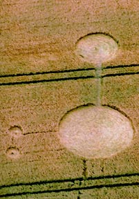 Dumbbell and two side circles with raised centers reported at Silbury Hill near Avebury, Wiltshire on July 21, 2004. Aerial photograph © 2004 by Lucy Pringle.