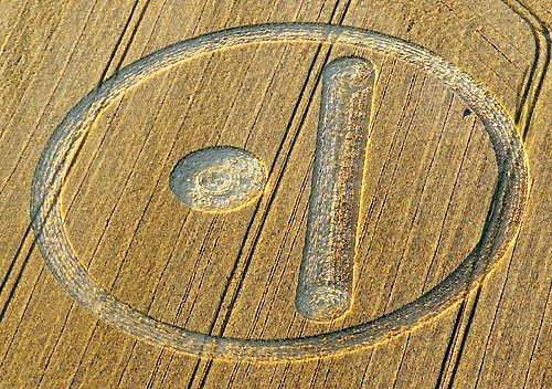 Stanton St. Bernard, near Alton Barnes, Wiltshire, England, reported August 12, 2007. Pattern is equivalent to the Mayan number "6." Reported six days before August 18, 2007. Aerial image © 2007 by Philippe Ullens. Also see: Cropcircleconnector.com.
