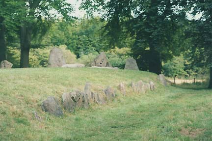 Wayland's Smithy long barrow edged in standing stones is 56.4 meters long (185 feet) and 13.1 meters wide (43 feet). Fourteen bodies were buried with arrow heads, pottery fragments and quernstones for grinding corn. Photograph © 2006 by Linda Moulton Howe.