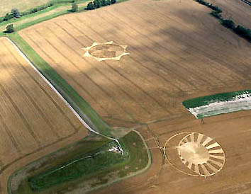 West Kennett 8-pointed star reported July 29, 2004, and "moon and sun" reported two weeks earlier on July 13, 2004, in wheat field near Silbury Hill. Photograph © 2004 by Cropcircleconnector.com.