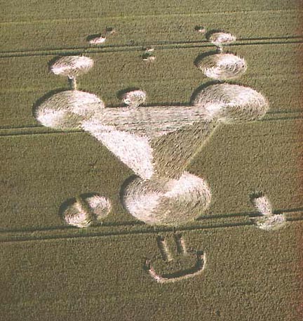 West Overton wheat field, formation reported July 9, 2002. Each circle at corners of triangle about 30 feet in diameter. Side lengths of triangle about 50 feet. Aerial photograph © 2002 by Steve Alexander. Also, see http://www.cropcircleconnector.com.