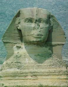A 20th Century photograph of the Sphinx showing weathering and damage from deliberate attacks over the ages, Cairo, Egypt. The Sphinx was carved, method unknown, from one single ridge of stone that was 240ft long. Its length is 150 feet and the paws alone are 50 feet. Its height is 66 feet. The head measures 30 feet long and 14 feet wide.