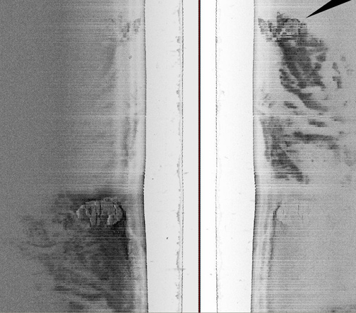  Lower left:  197-foot-diameter unidentified structure is 275 feet down on the floor of the Baltic Sea some 60 nautical miles from nearest land between Sweden and Finland. Discovered on June 19, 2011, on the last day of a treasure hunting expedition to find sunken wrecks, a second smaller anomaly (upper right arrow) was also found 600 feet away. Side scan sonar image © 2011 by Ocean Explorer X-Team, Sweden.