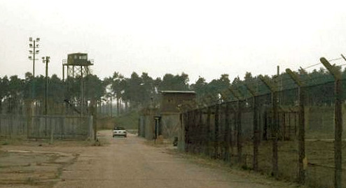 Above: Approaching highly secure Weapons Storage Area tower and bunkers at RAF Bentwaters. Below: Razor wire and double fence lines guard the WSA at RAF Bentwaters. Images © 2002 by Tim Egercic.