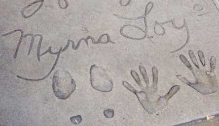 Myrna Loy's 1936 hand prints in wet cement outside Grauman's Chinese Theater, Hollywood, California. Image source Wikipedia.