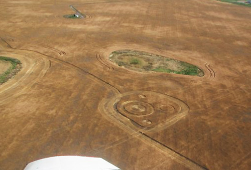 Green, shallow, slough behind wheat formation. Aerial image © 2009 by Rob McNeill.