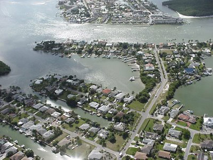 Aerial of Isles of Capri homes and boat docks.