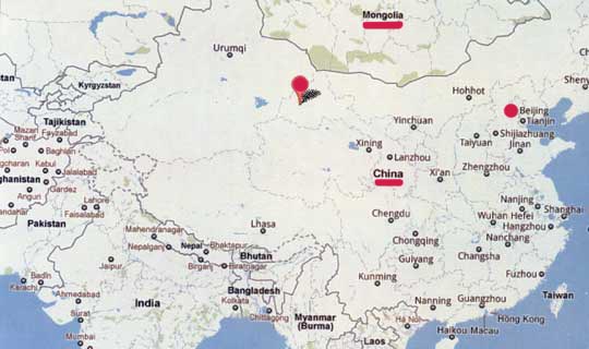 China's “Area 51” ground patterns are southwest of the Great Gobi Desert A in Gansu Province south of Mongolia (center red circle). The nearest town is Dunhuang (below) that is 1,515 miles (2,438 km) west of Beijing (far right red circle).
