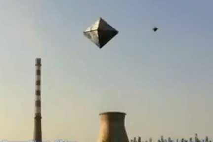 Loud pulsing “hum” of two diamond-shaped aerial objects above the Hebei Luannan Power Plant inside Luannan County, Tangshan City, Hebei Province, China. The smaller diamond-craft is orbiting the larger diamond-craft. Click video posted at YouTube on September 9, 2011.