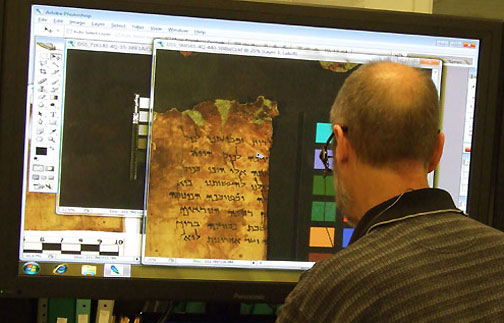 Scholar working with Dead Sea Scroll images on computer.  The Israel Antiquities Authority is collaborating with the Google R&D center in Israel to upload all 30,000 Dead Sea Scrolls fragments, as well as additional data that will allow users to perform searches across a broad range of data in a number of languages and formats. Image 2010 courtesy Israel Antiquities Authority.