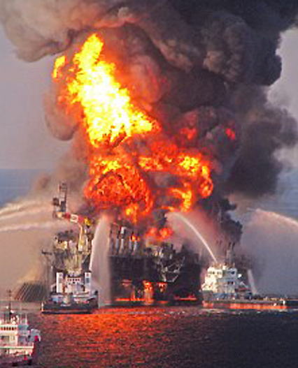 BP Deepwater Horizon oil rig burning after the April 20, 2010, explosion that killed 11 men working on the platform and injured 17 others. The disastrous crude oil gusher from the broken BP Macondo well a mile down on the sea floor lasted from April 20 until July 15, 2010, when the well was finally capped. Meanwhile, 770,000 gallons of toxic Corexit dispersant had been sprayed on Gulf waters to allegedly reduce the thick oil slick. Image by EPA.
