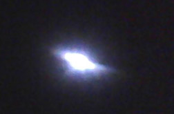 September 12, 2010, cell phone image of glowing disc over flight line near “Pacer Fence,” Hill AFB, Ogden, Utah.