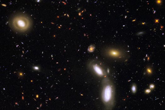 Portion of earliest universe photographed so far by Hubble Space Telescope. Hubble's WFC3/IR camera was able to make deep exposures to uncover new galaxies at roughly 40 times greater efficiency than its earlier infrared camera that was installed in 1997.