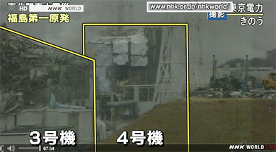 Hole is showing in the wall of Unit # 4 on March 16, 2011, that has been on fire at Fukushima Dai-ichi nuclear power plant, Japan. Image © 2011 by NHK World TV news.