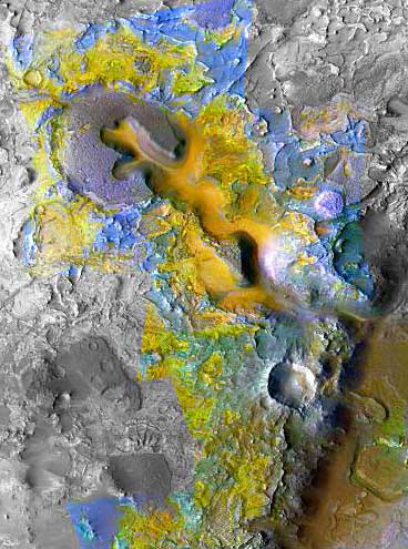 NASA's Mars Reconnaissance Orbiter has finally found carbonate minerals on Mars that show up as green in the above image of a 12-miles-wide region in Nili Fossae on the edge of the Isidis impact basin. Scientists hypothesize the carbonates might have formed at the surface when olivine-rich rocks were exposed and altered by running water. Image courtesy NASA/JPL/JHUAPL/MSSS/Brown University.