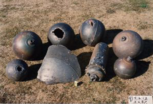 Back row:  Group of four similar-sized titanium alloy spheres found on April 3, 1972, by farmer John Lindores about 10 miles south of Ashburton. Front row: Two smaller spheres, larger spacecraft piece and cylindrical structure found further south of John Lindores farm. Photograph © Ashburton Aviation Museum.