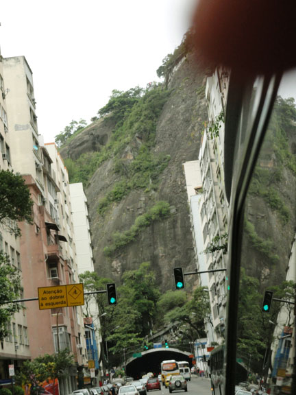Rain forest-covered volcanic walls rise straight up from many streets of the beautiful, French-Portuguese style Rio surrounded by the breath-taking beauty of wild nature and the powerful Atlantic Ocean. September 26, 2010 image © by Linda Moulton Howe.