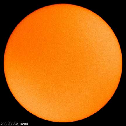 No sunspots on sun, August 28, 2008, and the sun has been going spotless for weeks at a time. The minimum of solar cycle 23 was 1996 and NASA says solar cycle 24 began on December 11, 2007 (see images below). Image courtesy SOHO.