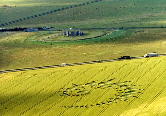 The fractal Julia Set was first reported across the A303 highway from ancient Stonehenge on July 7, 1996. The formation measured 915.5 by 508 feet, covered a square acre and was made of 151 circles. The center of each circle twisted differently, according to field investigators. Aerials above and below © 1996 by Lucy Pringle.