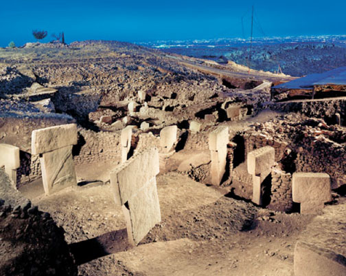 Gobekli Tepe in Turkish means “Potbelly Hill,” an archaeological site about eight miles northeast of Sanliurfa/Urfa not far from the Syrian border. Urfa city lights in background.