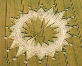 Part 2 of Cannings Cross near Allington, Wiltshire, England, reported on July 10, 2009, with additional circles at the outer points. Inside the farmer's original June 27th circles of wheat cut down, the cut off interior points have been reconstructed into fresh, new points. Aerial image © 2009 by Olivier Morel (WCCSG). For other images and information: Cropcircleconnector.