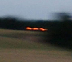 Three orange lights moving near Guy's Cliffe, Warwickshire, England, wheat formation on July 12, 2010, and caught on low-light shutter speed at around 1/15th to 1/30th of a second. Image © 2010 by Andrew Pyrka. 