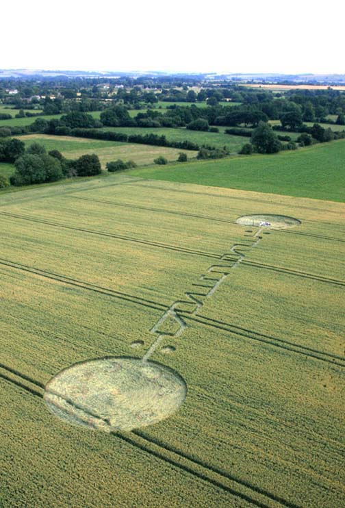Nearly 300-foot-long crop pattern in Honey Street field near Alton Barnes, Wiltshire, England, reported July 4, 2011, has symbols some interpret as Pi. Image © 2011 by Lucy Pringle.