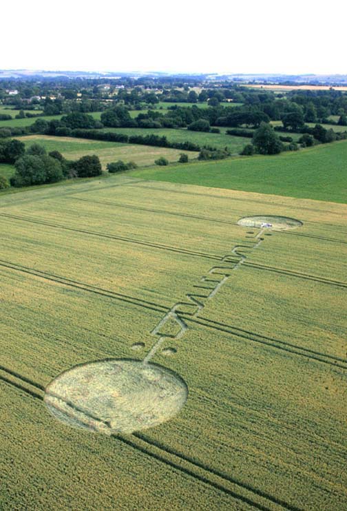Nearly 300-foot-long crop pattern in Honey Street field near Alton Barnes, Wiltshire, England, reported July 4, 2011, has symbols some interpret as Pi. Image © 2011 by Lucy Pringle.