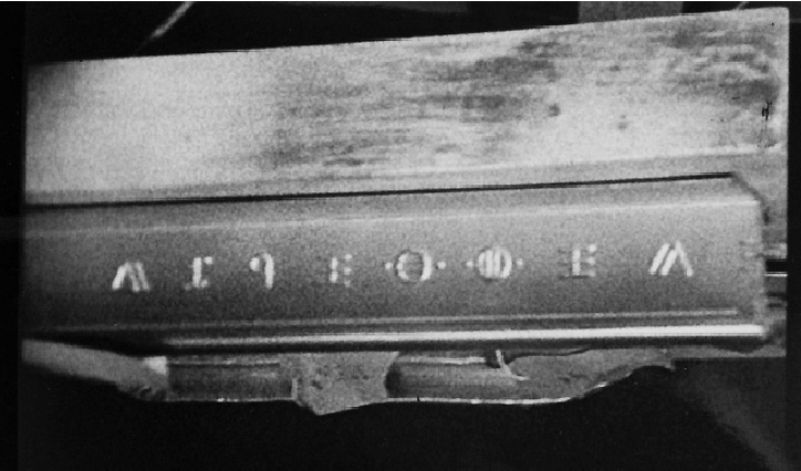 The alleged 1947 U. S. Army film of UFO crash debris near Socorro, NM, contained this I-beam with symbols that resemble ancient Greek letters.